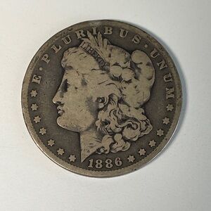 1886-O Morgan Silver Dollar (New Orleans)– 90% Silver – Circulated – See Photos